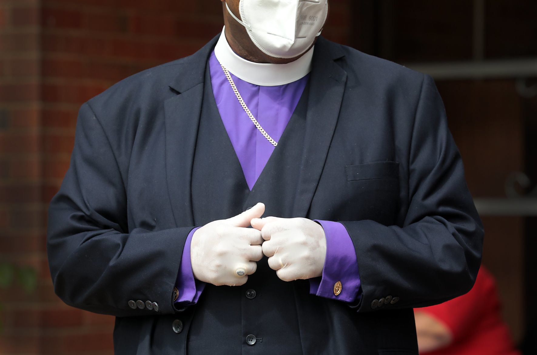 Clergy distributing masks to area churches